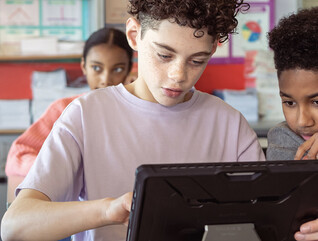 Kids working on group assignment during class