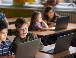 Students using computers in class