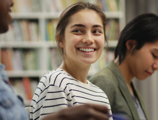 Students talking in the library