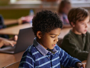 Students using computers in classroom