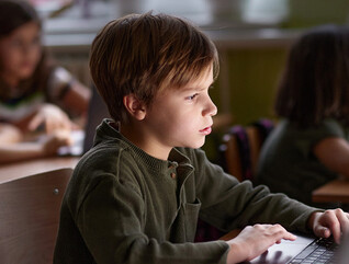 Students using computers in class