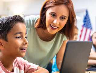 Teacher helping student 