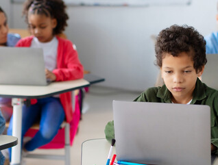 Students using devices in class