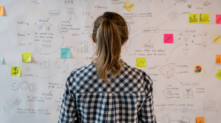 Woman looking at whiteboard