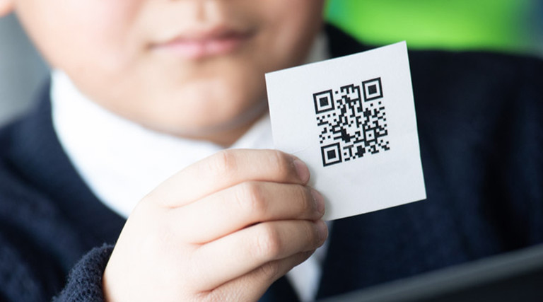 Kid with QR code card