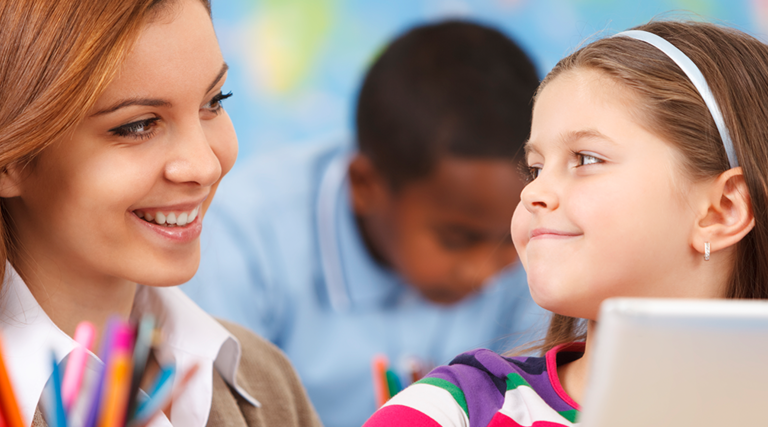 teacher and girl with tablet