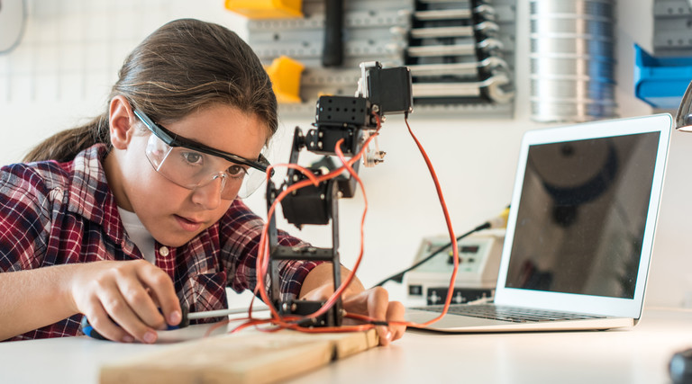 Girl works on engineering project.