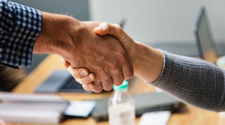 Two people shaking hands