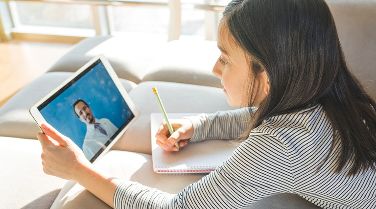 girl studying online from tablet