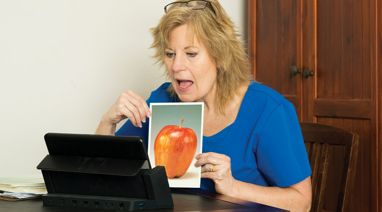 woman doing speech-language therapy online