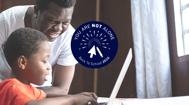 father helping son with online homework