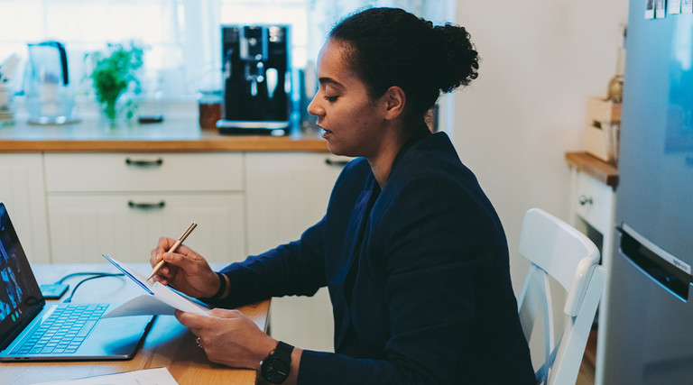 woman with laptop working from home 