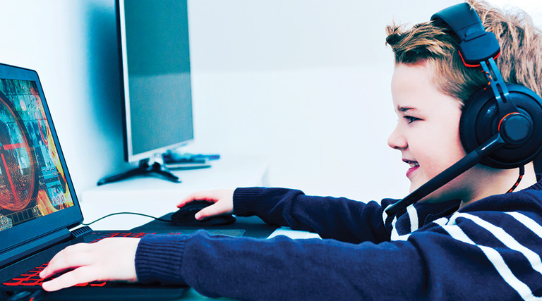 Boy playing esports at home