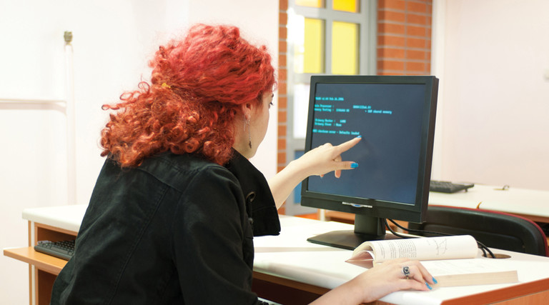 Threat Intelligence - woman in front of computer