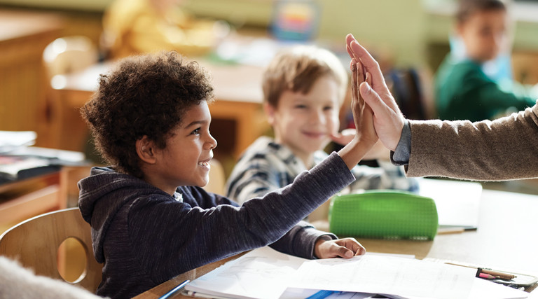 School kids excited in class