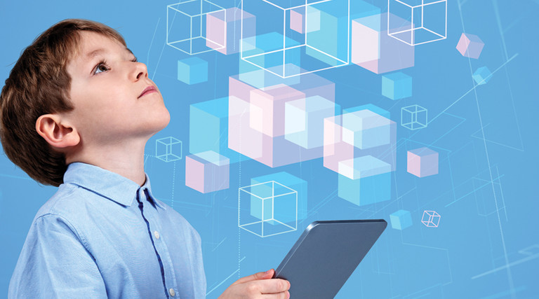 little boy holding tablet and looking at illustrated floating cubes