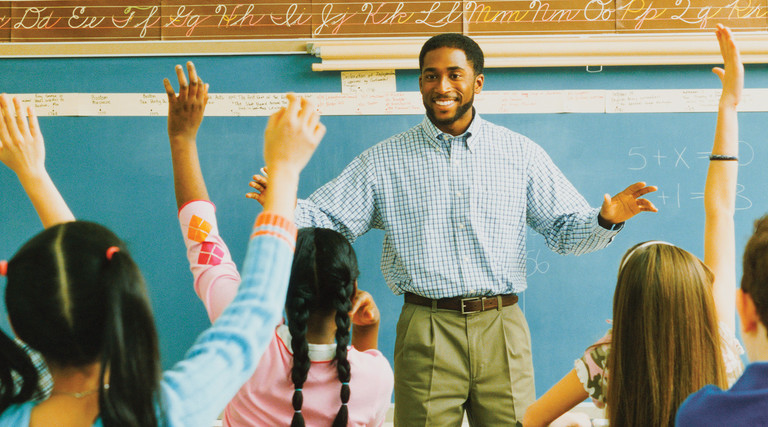 Teacher at the chalkboard calling on students