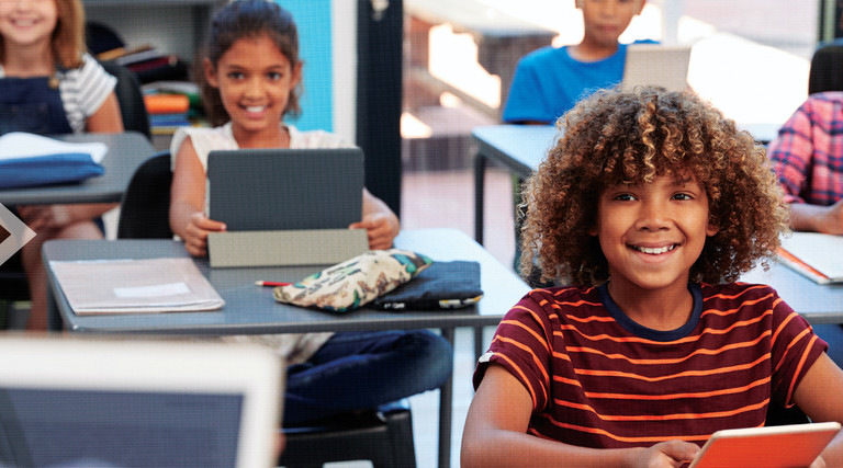 Students using tech in the classroom