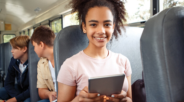 Student using tech on the bus