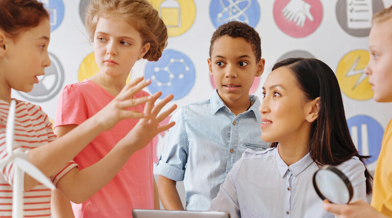 K-12 students learning STEM with teacher