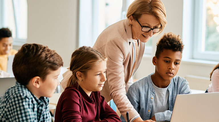 Teacher with students in classroom