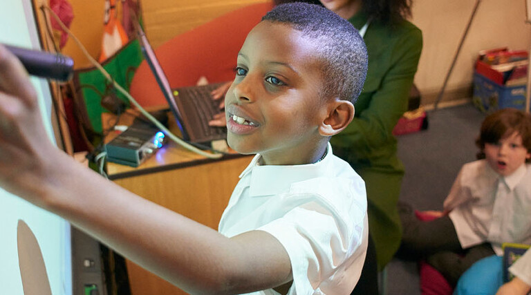 Student using interactive whiteboard