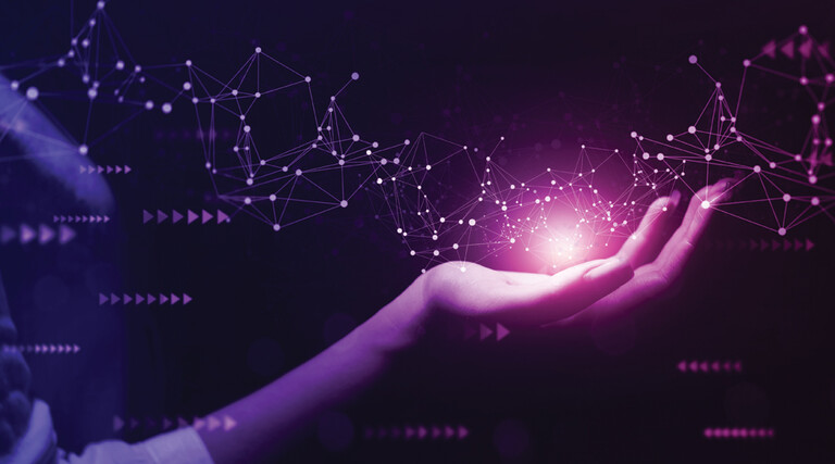 Hand holding glowing network connection