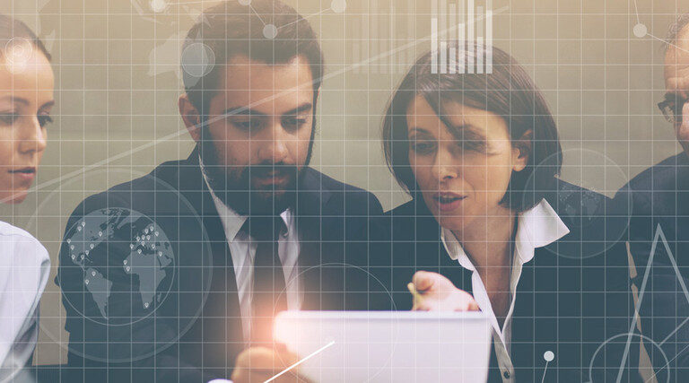People at a laptop with grid