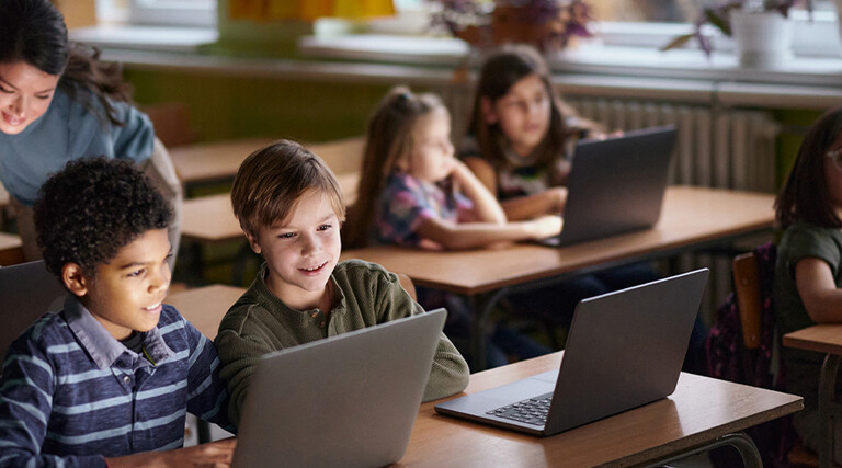 Students using computers in class