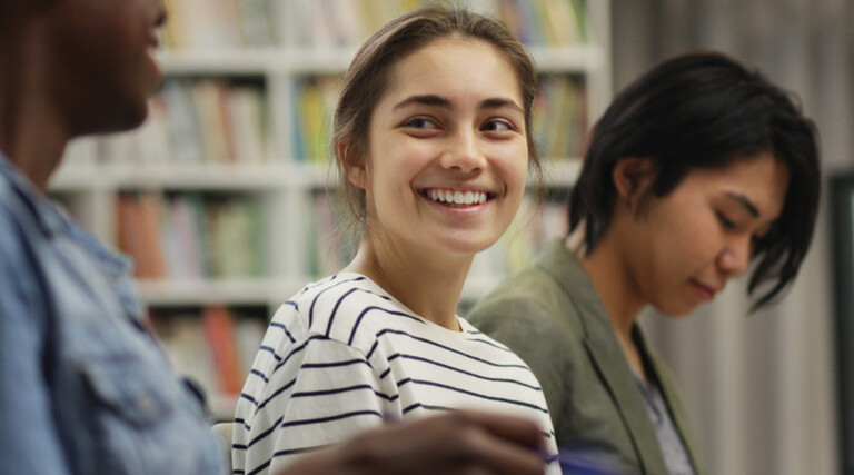 Students talking in the library
