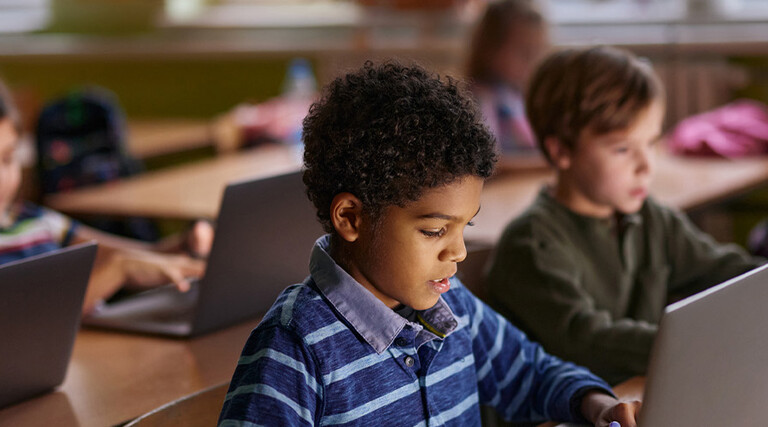 Students using computers in classroom