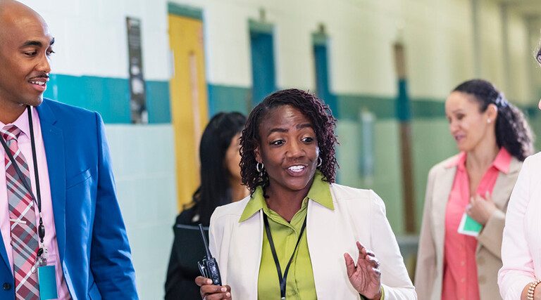 Teachers meeting in the hall