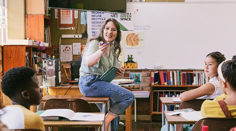 Teacher lecturing students in class