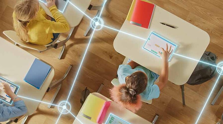 Students using tech in the classroom