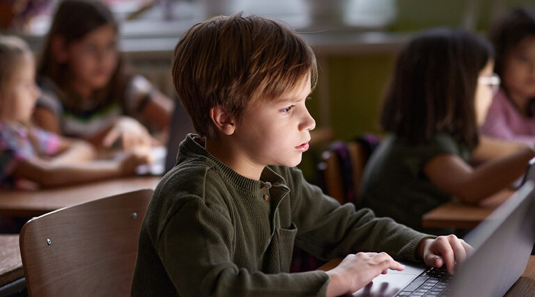 Students using computers in class