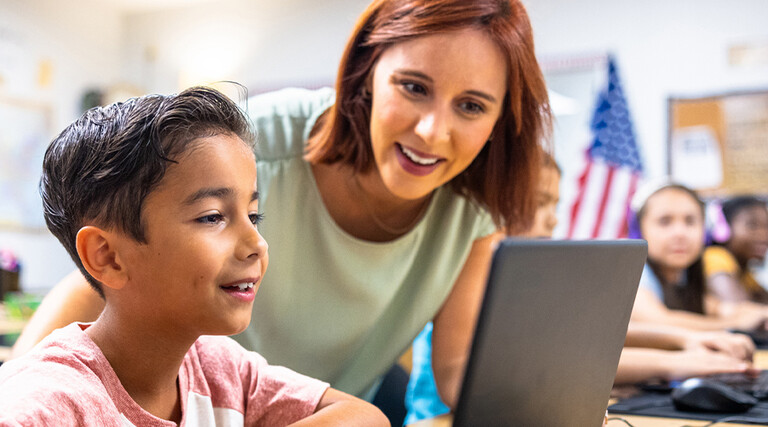 Teacher helping student 