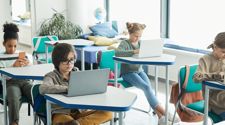 Students using devices in classroom