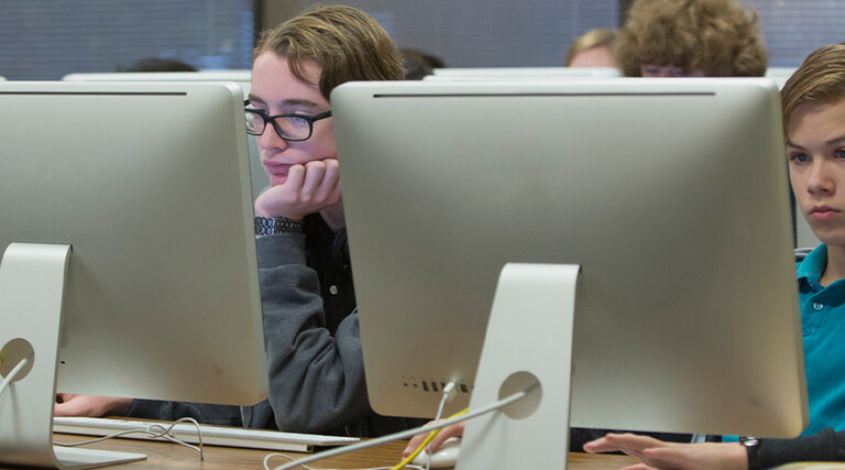Students using computers in school