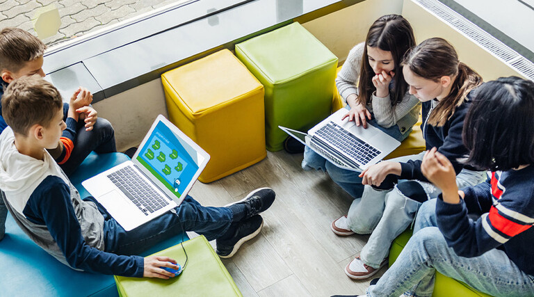 Students using computer in classroom