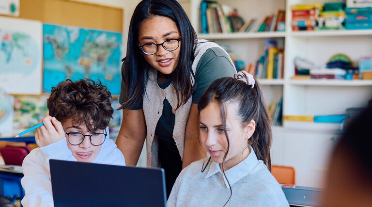 Students using computer in classroom