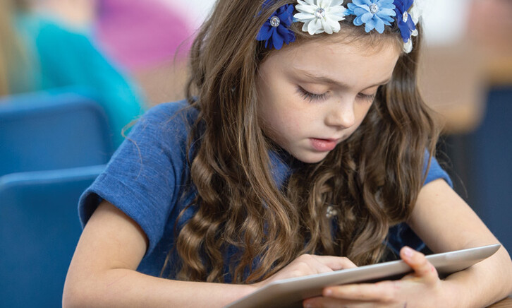 Student using tablet in class