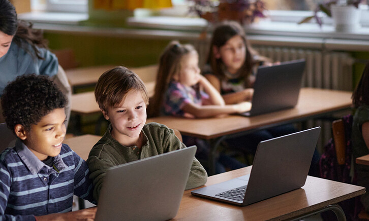 Students using computers in class