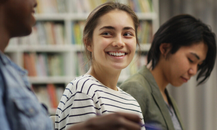 Students talking in the library