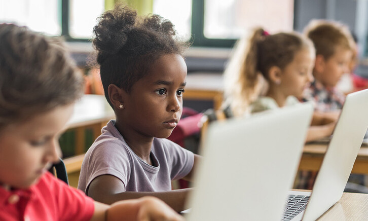 Students using devices in class