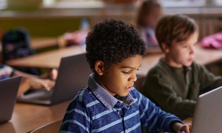 Students using computers in classroom
