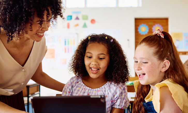 Students using tech in the classroom