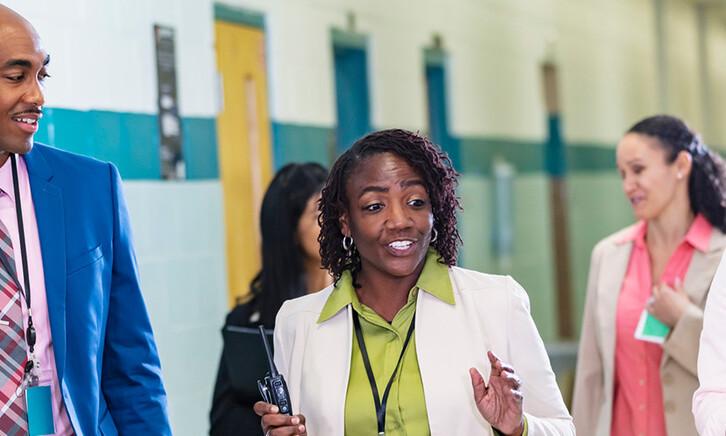 Teachers meeting in the hall