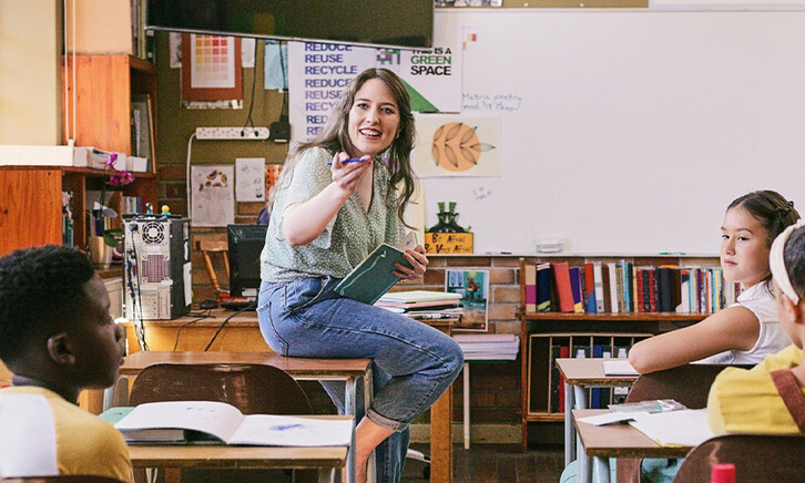 Teacher lecturing students in class