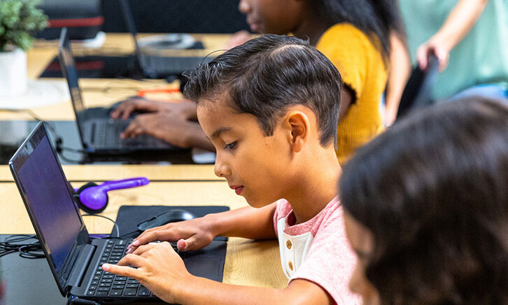 Students using tech in classroom