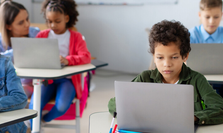 Students using devices in class